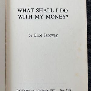 May include: Open book page with the title "WHAT SHALL I DO WITH MY MONEY?" by Eliot Janeway. The publisher is David McKay Company, Inc., New York. The text is in black font on an off-white page.