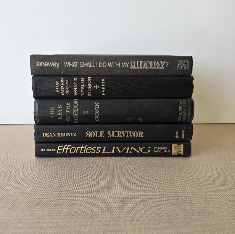 May include: A white ceramic mug with a black handle and the text "But First, Coffee" in a bold, black font. The mug is likely 11-15 ounces and sits on a white surface.