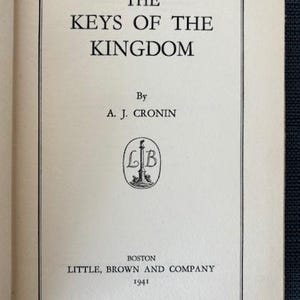 May include: A rustic wooden sign with the text "Welcome to our home" in white lettering. The sign features a distressed finish and a simple, inviting design, perfect for front door decor.