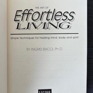 May include: A white ceramic mug with a black handle and the text "But First, Coffee" in a black, bold font. The mug is sitting on a wooden surface. The mug is approximately 4 inches tall.