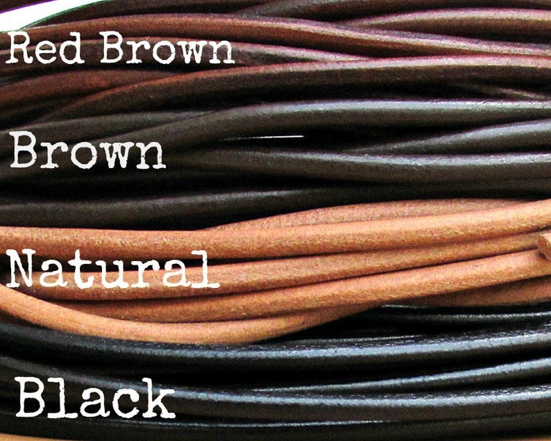 May include: Close-up of four different colors of leather cord: red brown, brown, natural, and black.