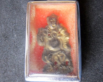 Protection amulet-pendant. Vintage God of Protection. Capsul containing gold leaf brass god.