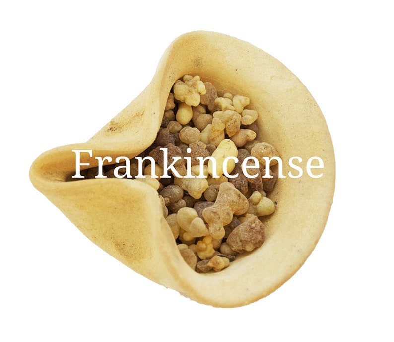 May include: A small, light brown ceramic bowl filled with frankincense resin. The resin is a mix of light brown, dark brown, and yellow pieces.