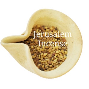 May include: A small ceramic bowl filled with brown and yellow Jerusalem incense. The bowl is light beige and has a unique shape.