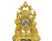 19th Century French Napoleon III Rocaille Style Gilt Dore Bronze Clock with Sèvres Style Porcelain Dial