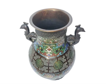 May include: A dark bronze vase with peacock-shaped handles and intricate enamel designs in shades of green, blue, and gold.