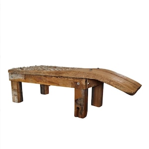 May include: A rustic wooden bench with a unique curved design. The bench is made of reclaimed wood and has a natural finish.