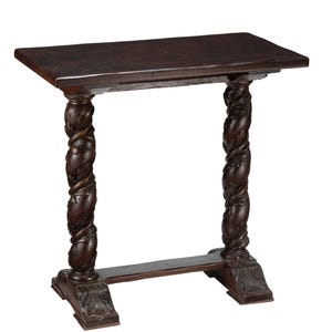 May include: Dark brown, antique-style side table. The rectangular tabletop rests on two intricately carved, twisted columns. A horizontal stretcher connects the columns near the base, which features carved leaf designs. The table is approximately 30 inches long.