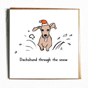 Dachshund a través de la nieve - lindo y divertido perro ilustrado juego de palabras tarjeta de Navidad.