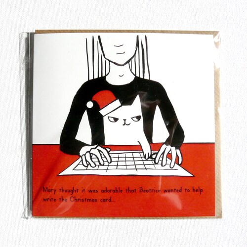 Cat helping to write the Christmas card. Funny illustrated Xmas cat card, super cute!
