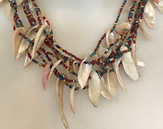 Unusual vintage tribal style multi strand seed beaded necklace with shell fringe