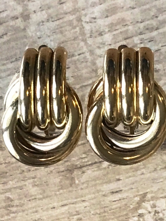 A beautiful pair of vintage gold plated clip-on earrings by makers Trifari