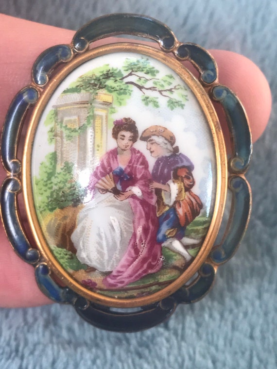 A striking vintage scenic brooch in enamel surround by Thomas L. Mott