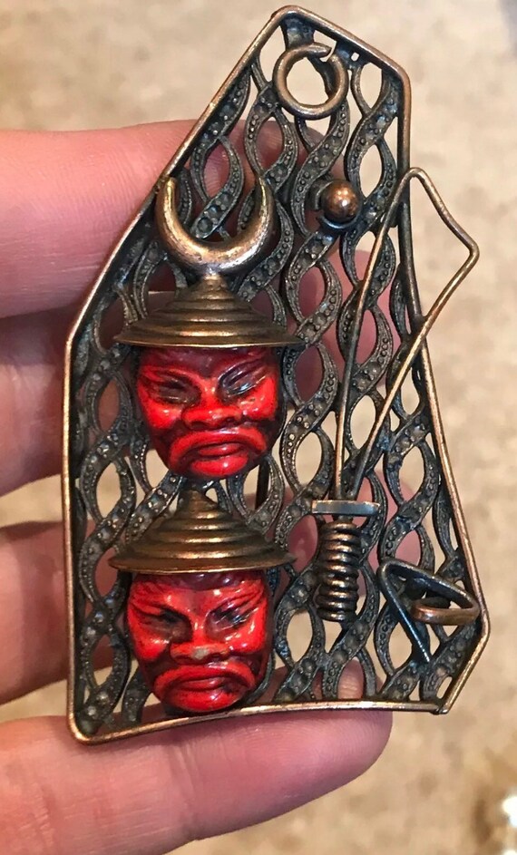 Unusual Vintage Asian red faced Warriors and Sword brooch