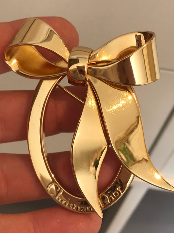 Authentic vintage iconic signed Christian Dior logo ribbon frame gold plated brooch pin