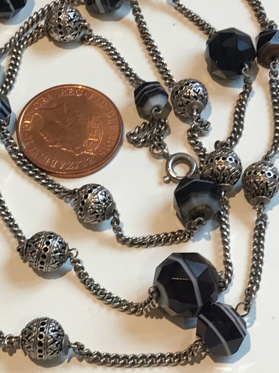 A long 900 silver Sautoir necklace set with banded agate beads 30 inches in length