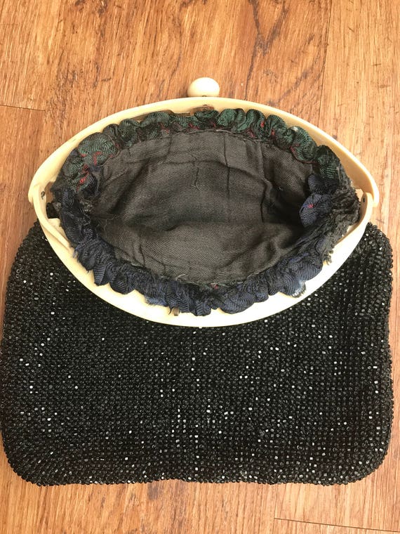 Beautiful black beaded 1920s Art Deco clutch evening bag carved celluloid push clasp handle