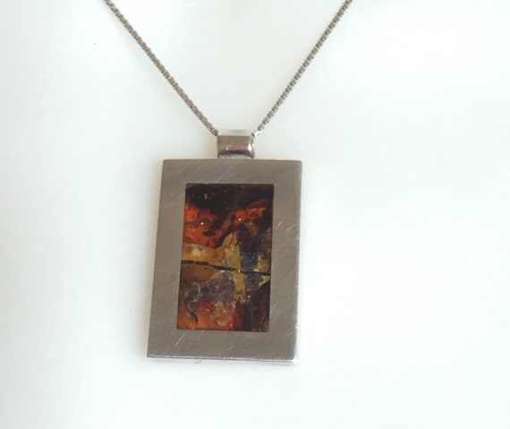 Solid silver and natural baltic amber pendant on silver chain