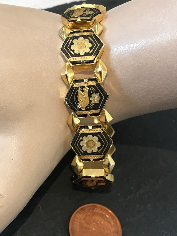 A Vintage Damascene black and gold linked panels cuff bangle bracelet birds and flowers