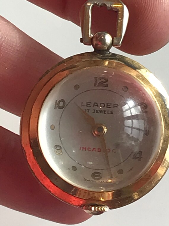 Vintage gold plated crystal ball pendant watch with clear Skeleton back by Leader