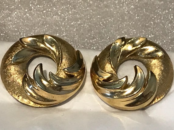 A beautiful pair of vintage clip-on earrings by makers Trifari crown logo