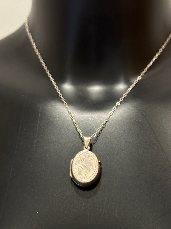 Small vintage silver locket on a 16 inch chain