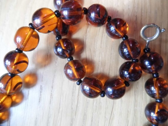 A striking Vintage Czech Amber glass beaded necklace.