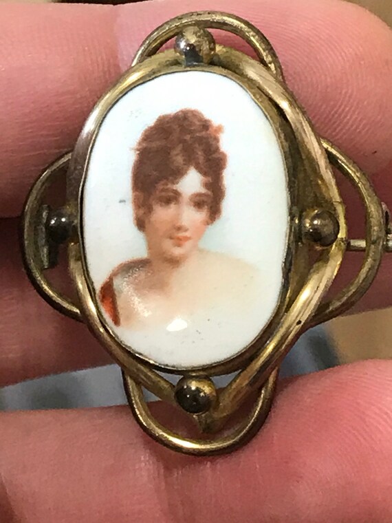 A striking Victorian portrait brooch in ornate frame