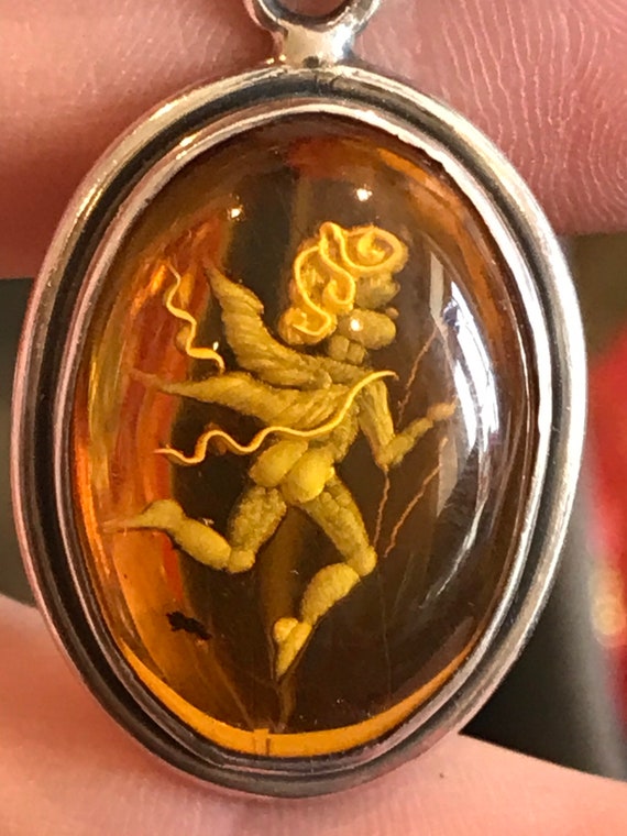 Vintage silver and Baltic carved Amber oval Cupid cherub Angel pendant