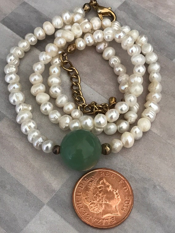 Fresh water pearl necklace with green hard stone accent ball pendant 21 inches