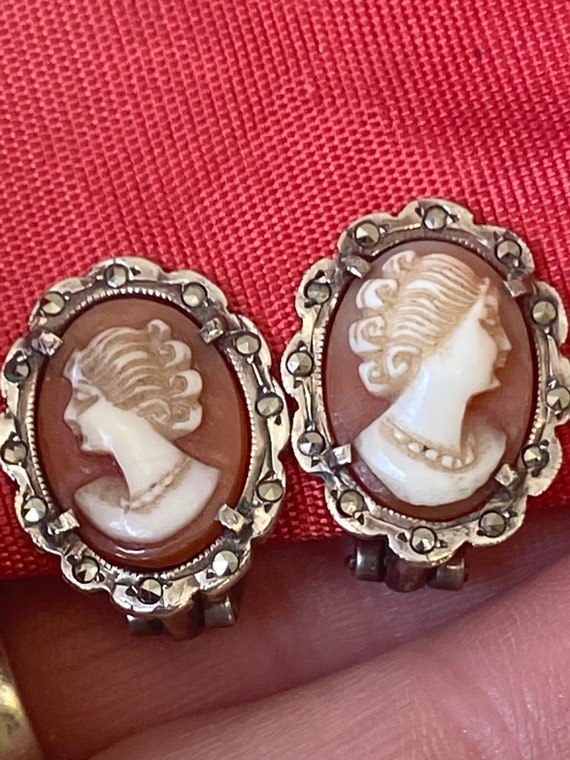 A Pair of vintage solid silver and Marcasite real carved cameo clip on earrings