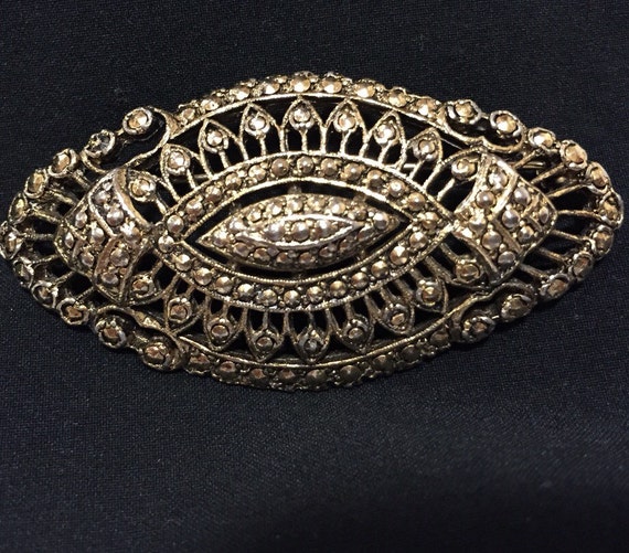 A striking vintage gold tone marcasite ladies brooch pin by KIGU