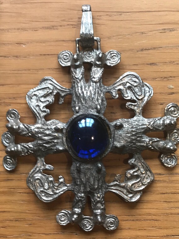 Oversized vintage pewter Celtic style statement piece pendant mythical beasts around a large blue glass cabochon.