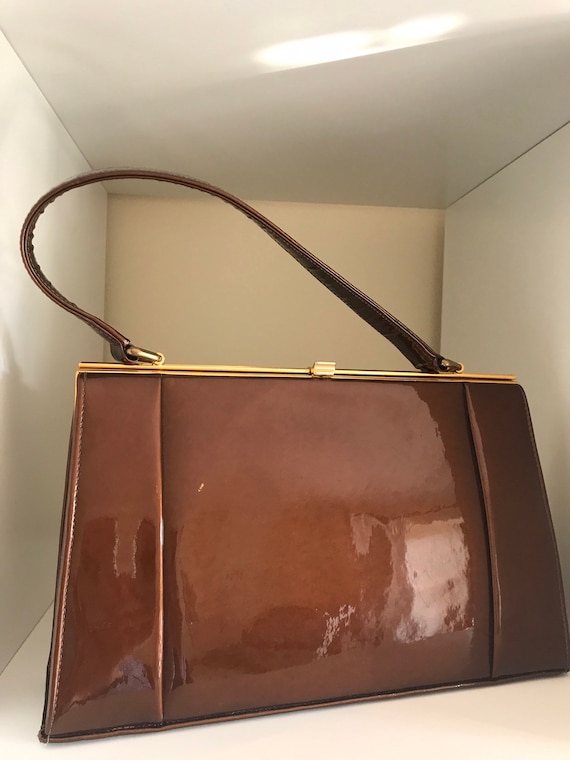Vintage Holmes of Norwich deep caramel coloured patten leather kelly style handbag framed 1950-60sc