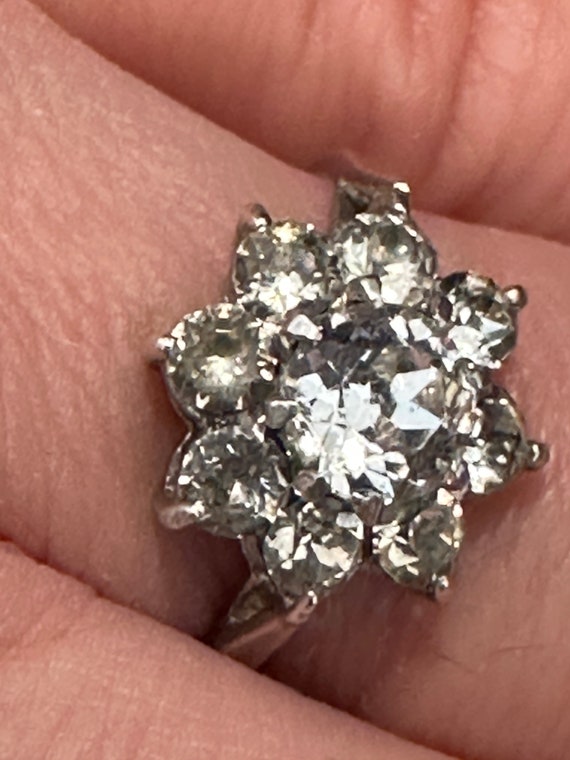 Here is a vintage silver and 9ct gold ring set with a cluster of clear stones a U.K. size of M1/2 or a US size 6.5.