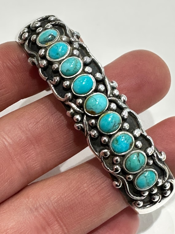 Vintage silver and turquoise cuff bracelet set with 9 turquoise cabochons