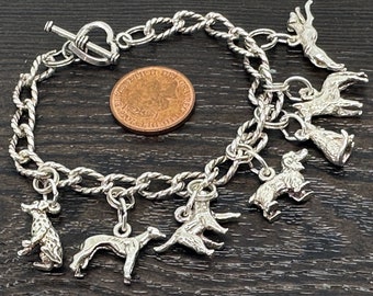 Lovely solid 925 silver circle link charm bracelet with 7 silver dog charms and heart shaped toggle fastener