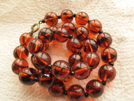 A striking Vintage Czech Honey Amber glass beaded necklace.
