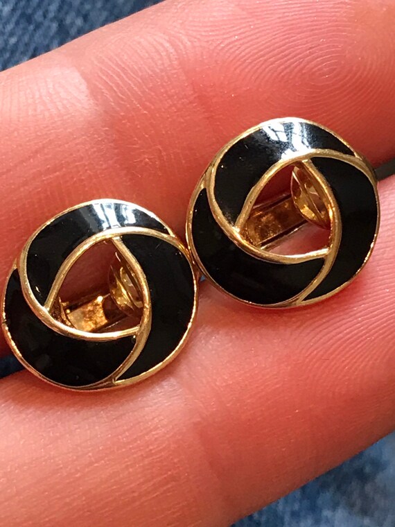 A beautiful pair of small signed vintage clip-on earrings by makers Trifari