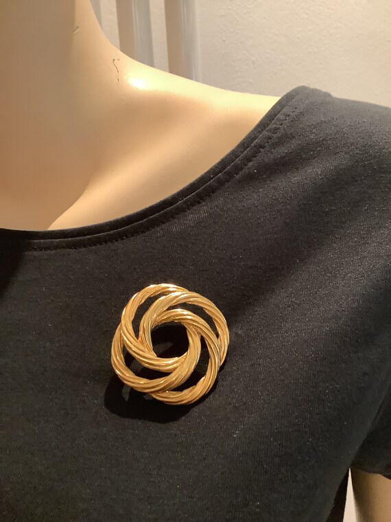 Classic gold plated woven knot style brooch pin by Monet