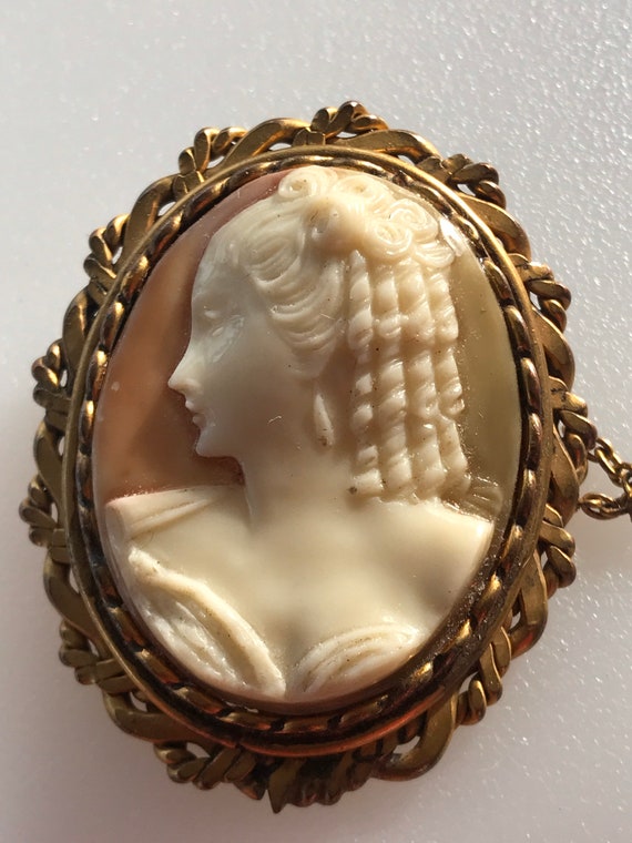 Antique/ Vintage celluloid cameo brooch in ornate gold filled frame
