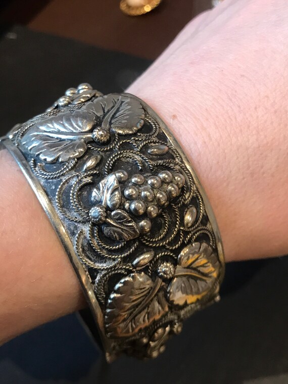 A Striking large silver plated hinged cuff bracelet in grapes and leaves designs