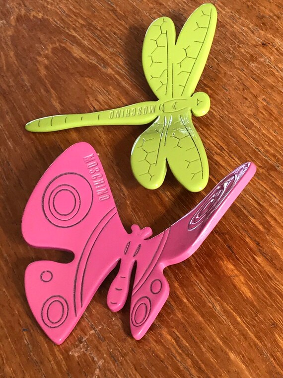 Two beautiful brightly coloured large plastic insect Brooches by Moschino