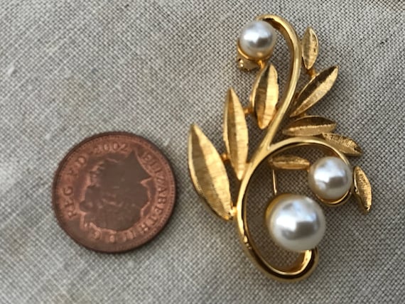 Striking faux pearl and goldstone statement piece brooch by designers Napier