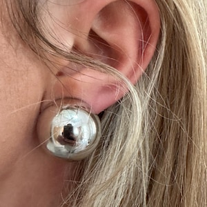 Vintage silvertoned round domed clip on earrings signed Grosse