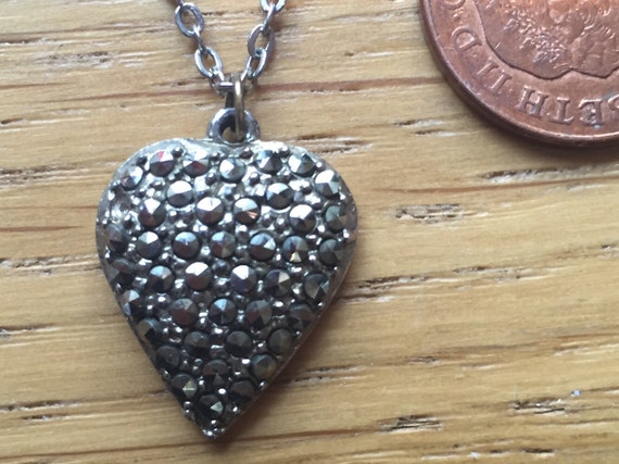 A vintage marcasite heart shaped pendant and chain