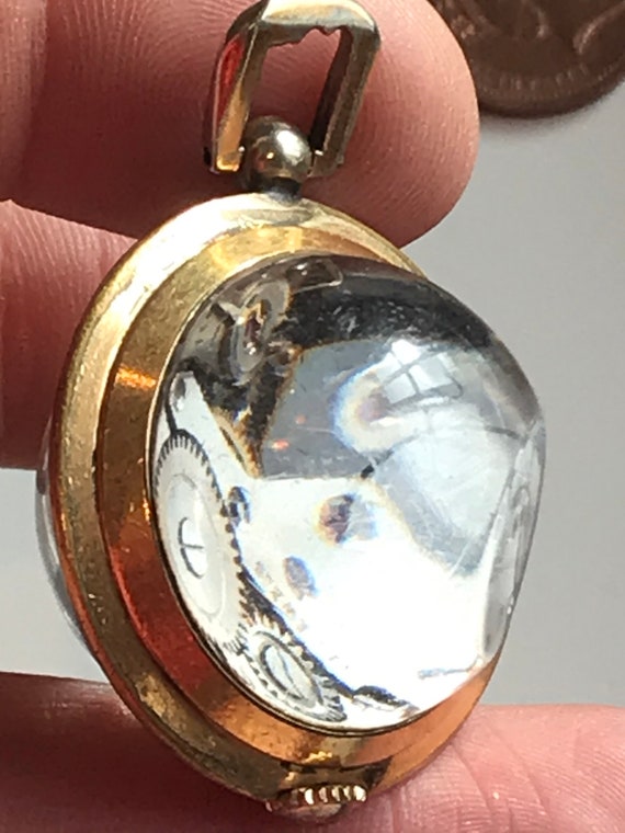 Vintage gold plated crystal ball pendant watch with clear Skeleton back by Leader