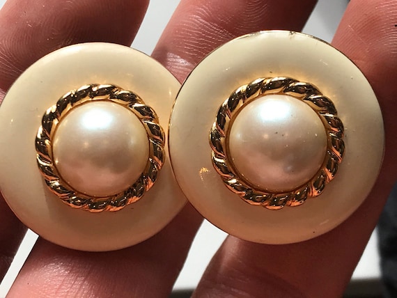A beautiful pair of enamelled faux pearl signed vintage clip-on earrings by makers MONET