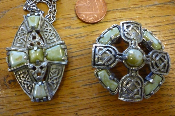 A striking Celtic style vintage pendant necklace and matching brooch in faux green agate