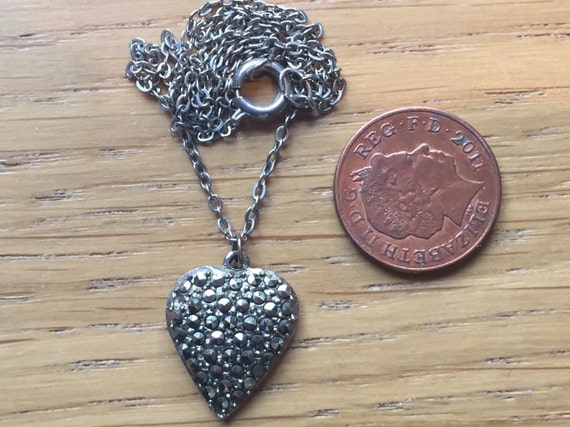 A vintage marcasite heart shaped pendant and chain